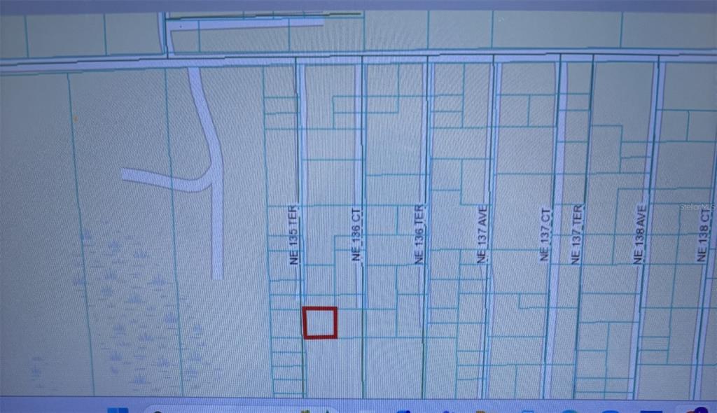This is a map showing a highlighted parcel of land among several residential lots — 0 NE 135TH TERRACE, FORT MC COY, FL