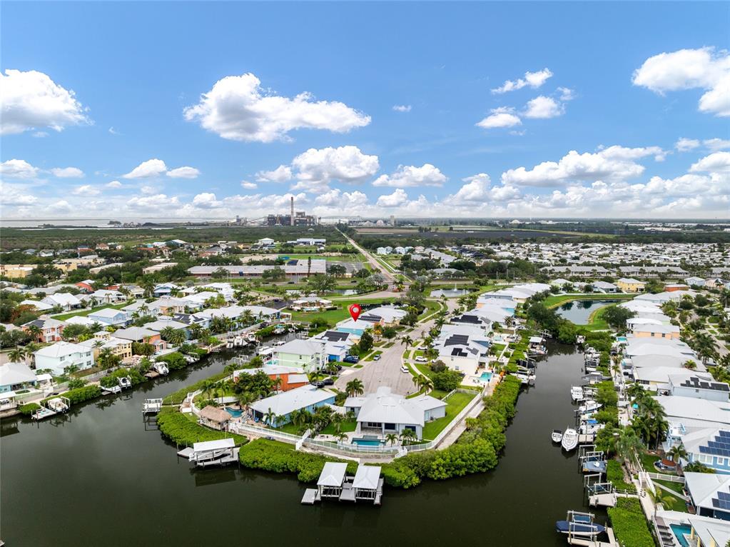 An aerial view shows waterfront houses with private docks along a canal in Florida — 6412 KEY ISLAND AVENUE, APOLLO BEACH, FL