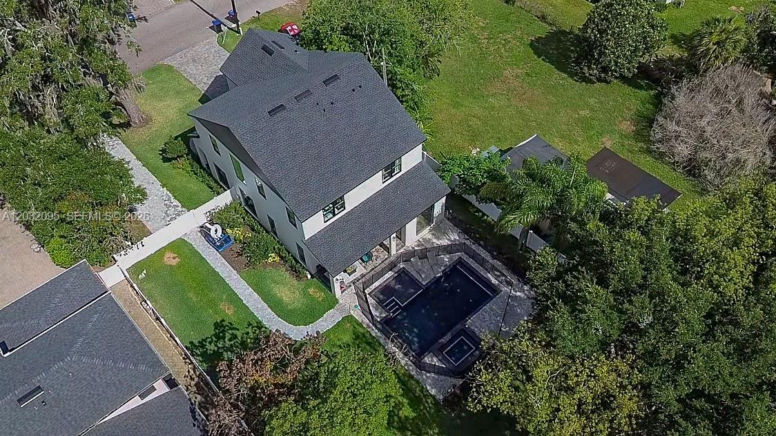 An aerial view of a two-story house with a pool and a fenced backyard — 1605 Jessamine Ave, Orlando FL 32806, ORLANDO, FL