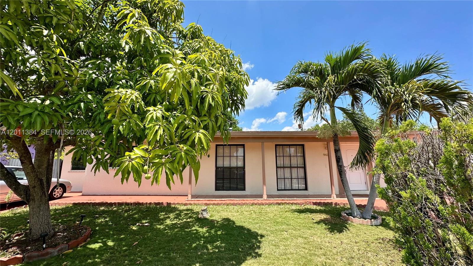 A single-story house with a front porch, two windows, and a white door — 9625 SW 164th St, Miami FL 33157, MIAMI, FL