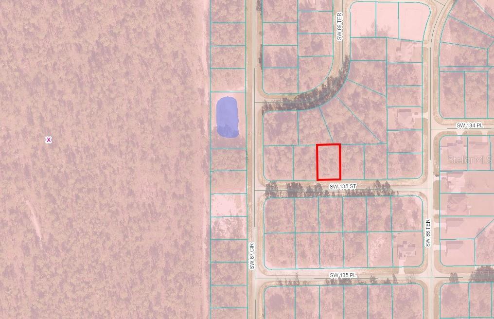 This is a map showing a rectangular parcel of land highlighted in red — SW 135 STREET, OCALA, FL