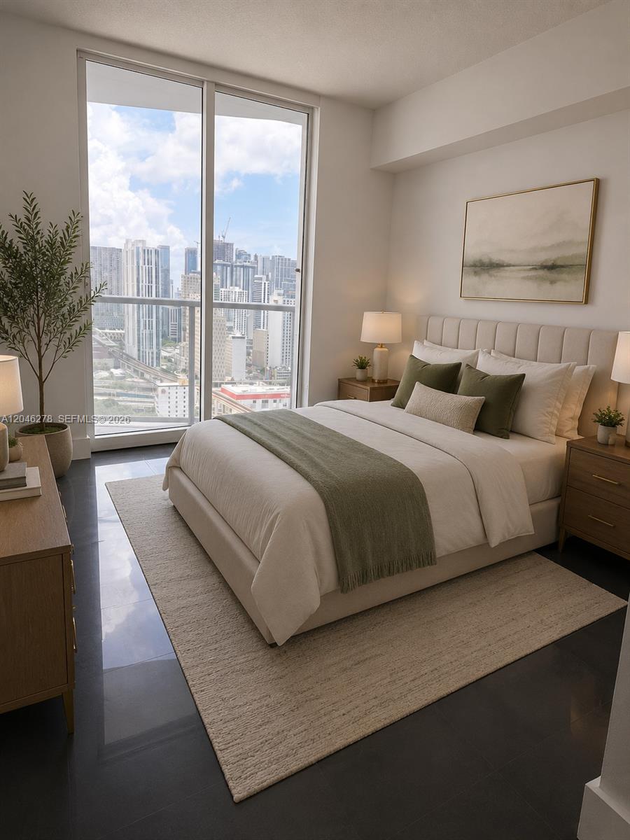 A modern bedroom features a bed with green accents, dark tile floors, and floor-to-ceiling city views — 185 SW 7th St # 3009, Miami FL 33130, MIAMI, FL