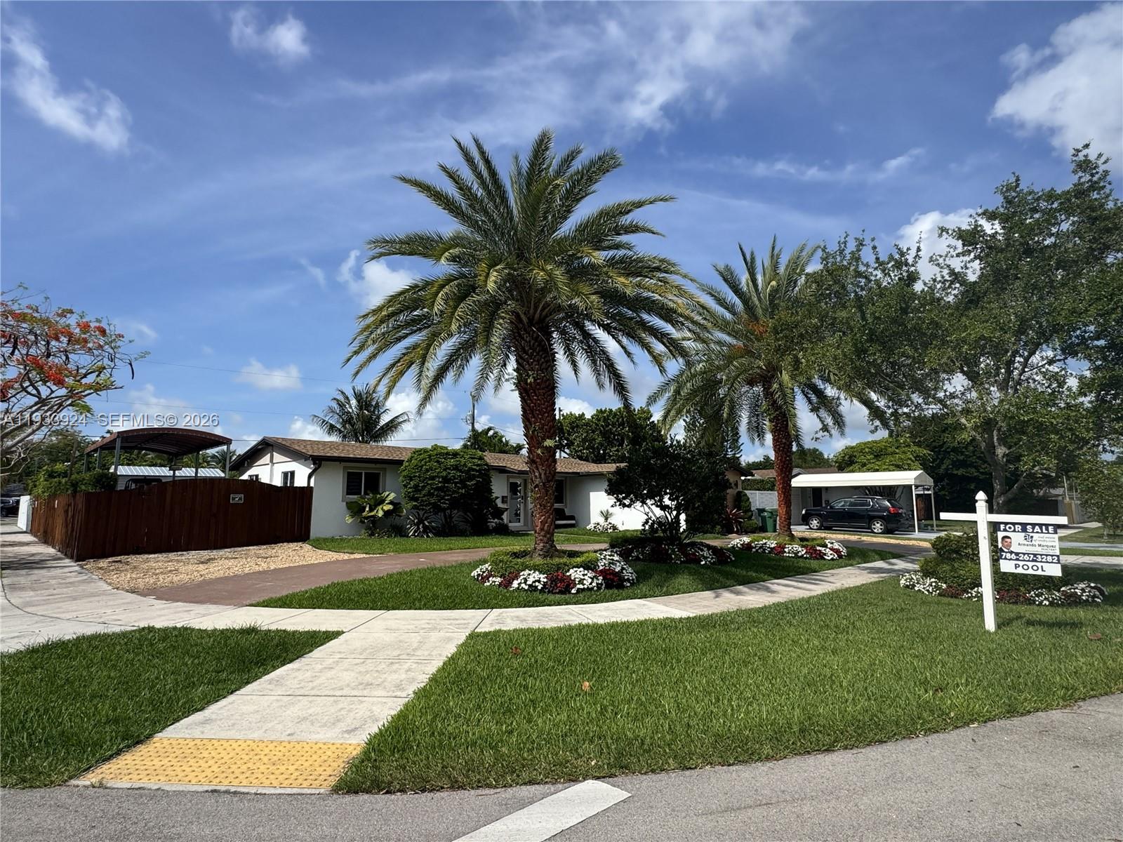 A single-story house with two palm trees and a for sale sign in the yard — 9300 SW 192nd Dr, Cutler Bay FL 33157, CUTLER BAY, FL