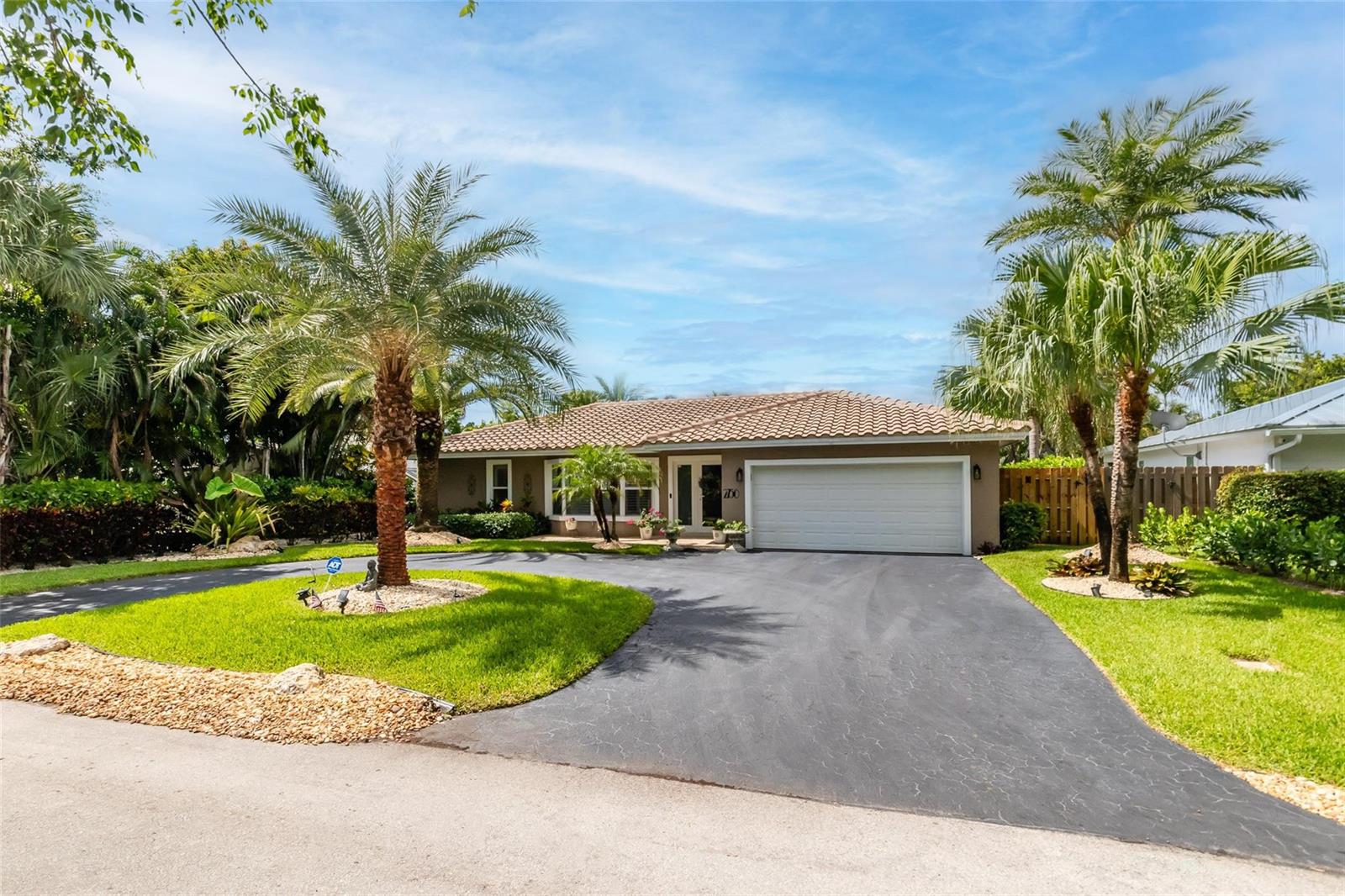 A single-story house with a tile roof, two palm trees, and a paved driveway — 2750 SE 4th Street, Pompano Beach FL 33062, POMPANO BEACH, FL