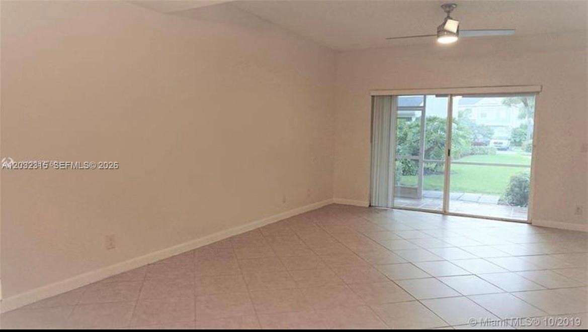 A kitchen features white cabinets, a stainless steel dishwasher, and a double-basin sink — 1 Simonton Cir # 1, Weston FL 33326, WESTON, FL
