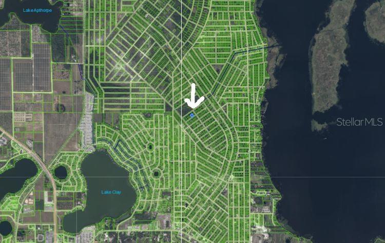 This is a satellite map view showing a highlighted property lot within a residential neighborhood — 1210 HAVILAND STREET, LAKE PLACID, FL