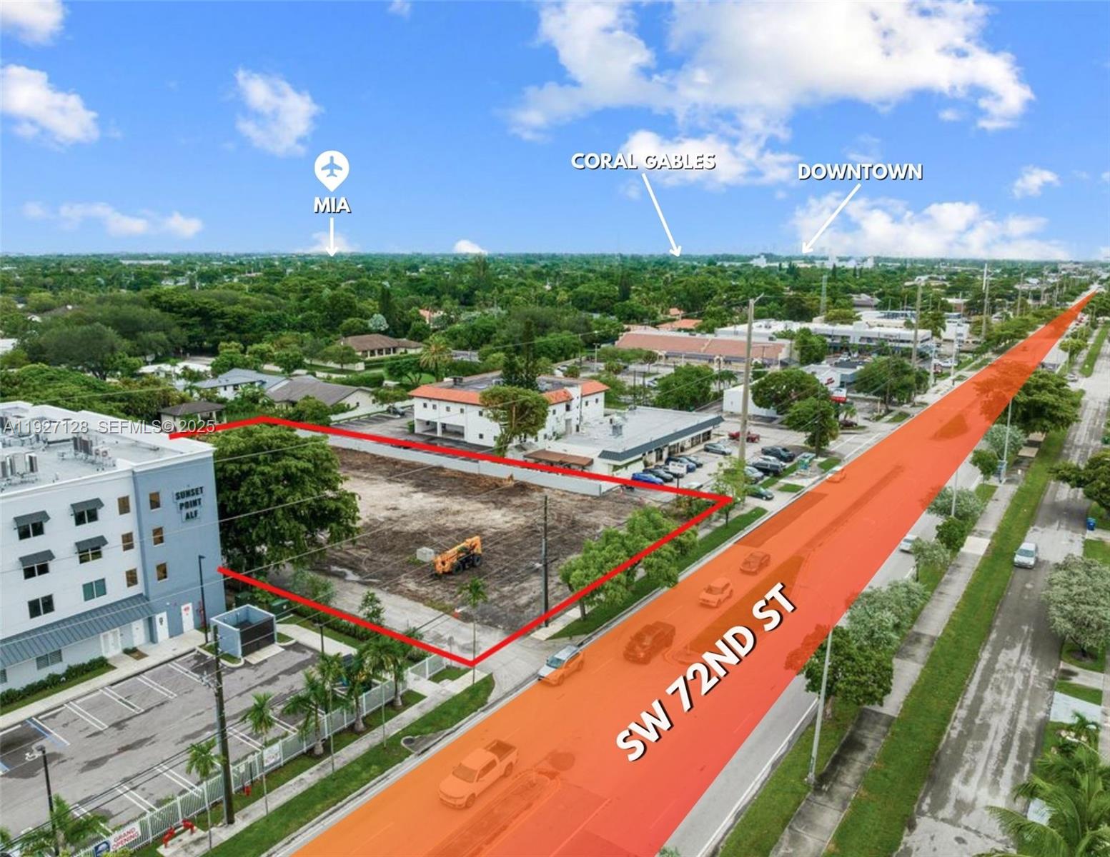 This aerial view shows a vacant rectangular lot outlined in red next to a building — 9945 SW 72nd St, Miami FL 33173, MIAMI, FL