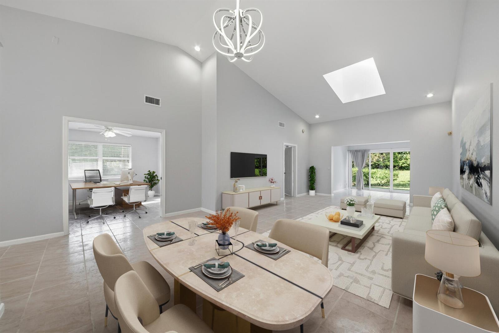 A bright open-concept living and dining area features vaulted ceilings, tile floors, and a skylight — 7617 Island Breeze Terrace, Boynton Beach FL 33437, BOYNTON BEACH, FL