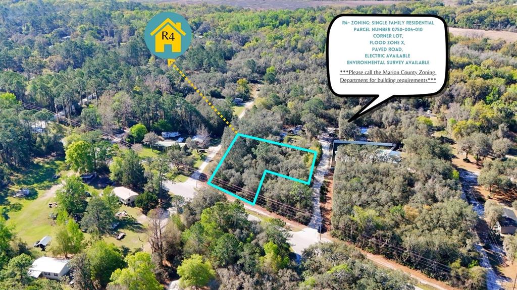 An aerial view shows a wooded, L-shaped residential lot outlined in blue with surrounding trees — TBD CORNER LOT 175TH STREET ROAD NE, CITRA, FL