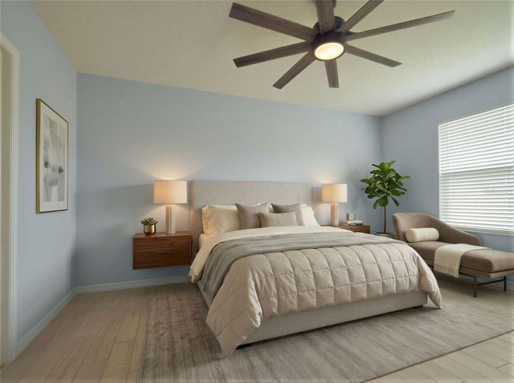 A bedroom features a bed with a light-colored headboard, two floating nightstands, and a ceiling fan — 5110 FIDDLEWOOD WAY, ST CLOUD, FL