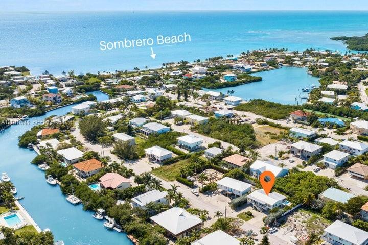 This aerial map shows a coastal neighborhood with a marked house near a canal — 320 Calzada De Bougainville, Marathon FL 33050, MARATHON, FL