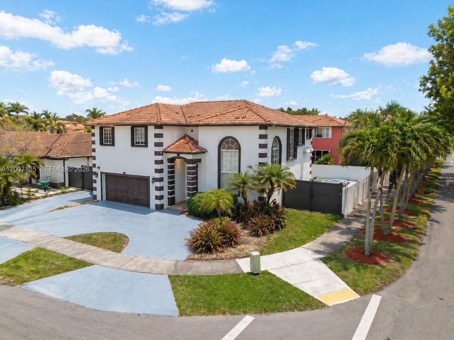 An aerial view of a two-story house with a tiled roof and a driveway — 5161 SW 159th Ct, Miami FL 33185, MIAMI, FL