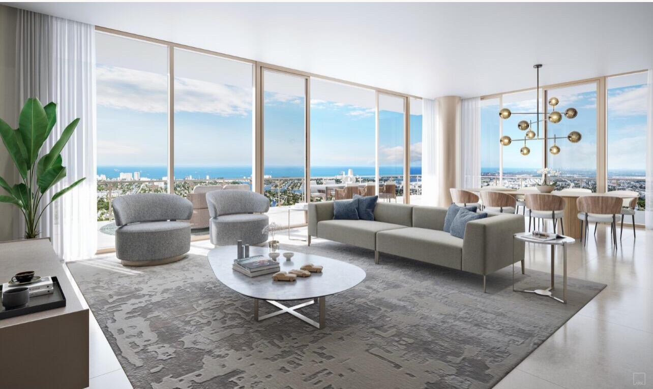 This rendering shows a modern living and dining area with floor-to-ceiling windows overlooking the ocean — 521 E Las Olas Boulevard # 1203, Fort Lauderdale FL 33301, FORT LAUDERDALE, FL