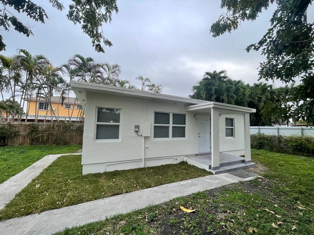 A small, white, single-story house with a flat roof and a covered front porch — 2103 SW 60th Ave # 2, Miami FL 33155, MIAMI, FL