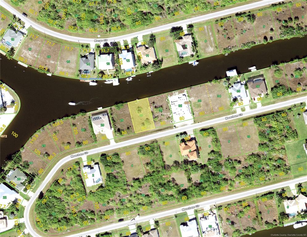 This is an aerial map showing residential lots and a canal in a suburban neighborhood — 15490 MEACHAM CIRCLE, PORT CHARLOTTE, FL