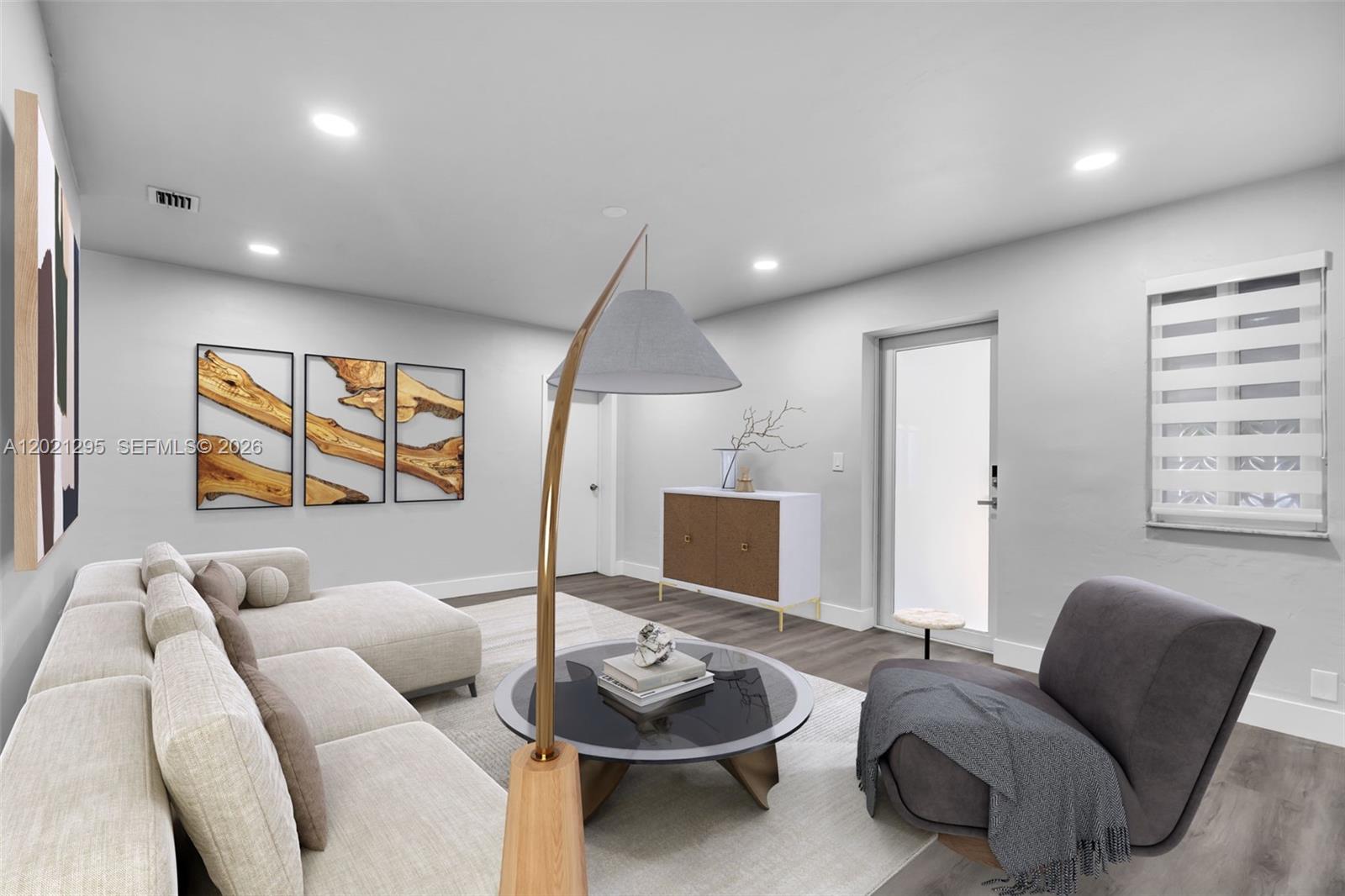 This is a digital rendering of a modern living room with a sectional and armchair — 648 South Dr, Miami Springs FL 33166, MIAMI SPRINGS, FL