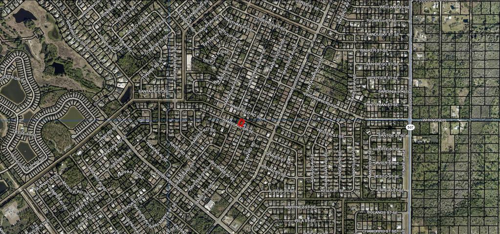 This is an aerial map showing a residential neighborhood with a red marker on a lot — 2201 RAMSDALE DRIVE SE, PALM BAY, FL