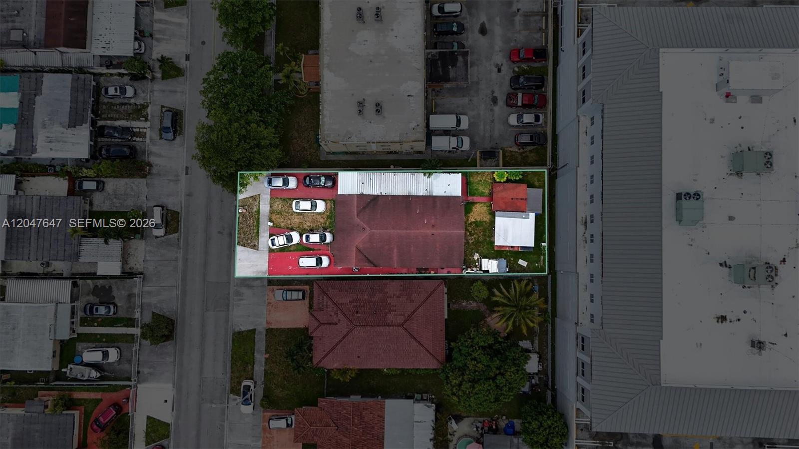 An aerial view shows a rectangular property with a house, driveway, and backyard structures — 525 E 24th St, Hialeah FL 33013, HIALEAH, FL