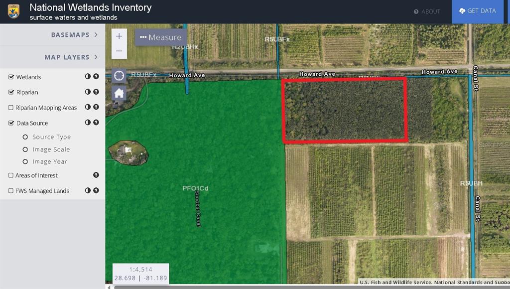 This map shows a wooded parcel of land outlined in red near Howard Avenue — 601 HOWARD AVENUE, OVIEDO, FL