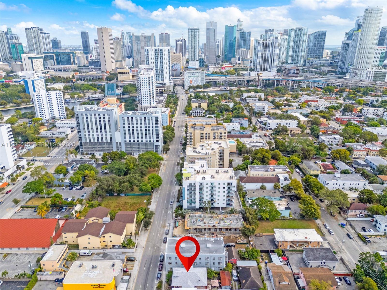 An aerial view shows a city street with a red location pin over a building — 676 SW 1st St, Miami FL 33130, MIAMI, FL
