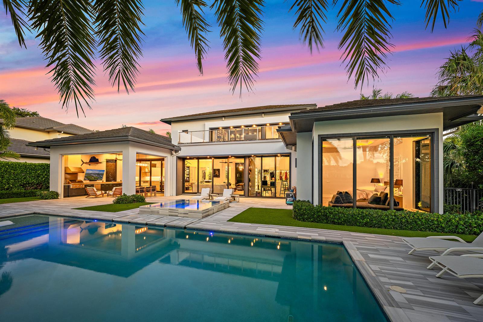 A modern house exterior with a swimming pool, hot tub, and large glass sliding doors — 162 Commodore Drive, Jupiter FL 33477, JUPITER, FL