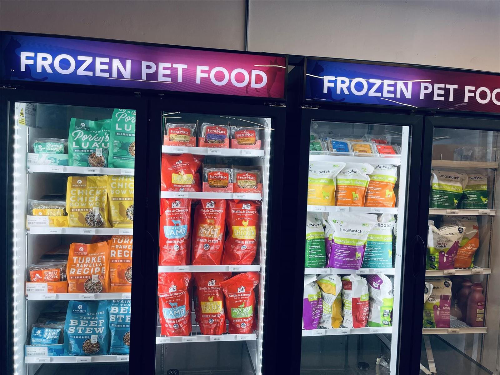 Glass-fronted refrigerators are stocked with various packages of frozen pet food — 1135 US Highway 1, Vero Beach FL 32960, VERO BEACH, FL
