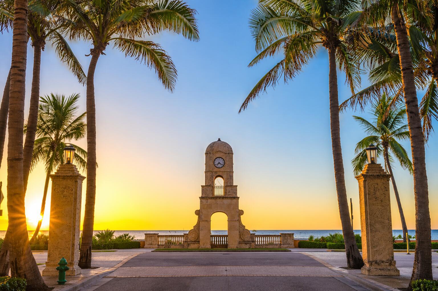 A stone clock tower stands at the end of a palm-lined path overlooking the ocean — 235 Sunrise # 3244, Palm Beach FL 33480, PALM BEACH, FL