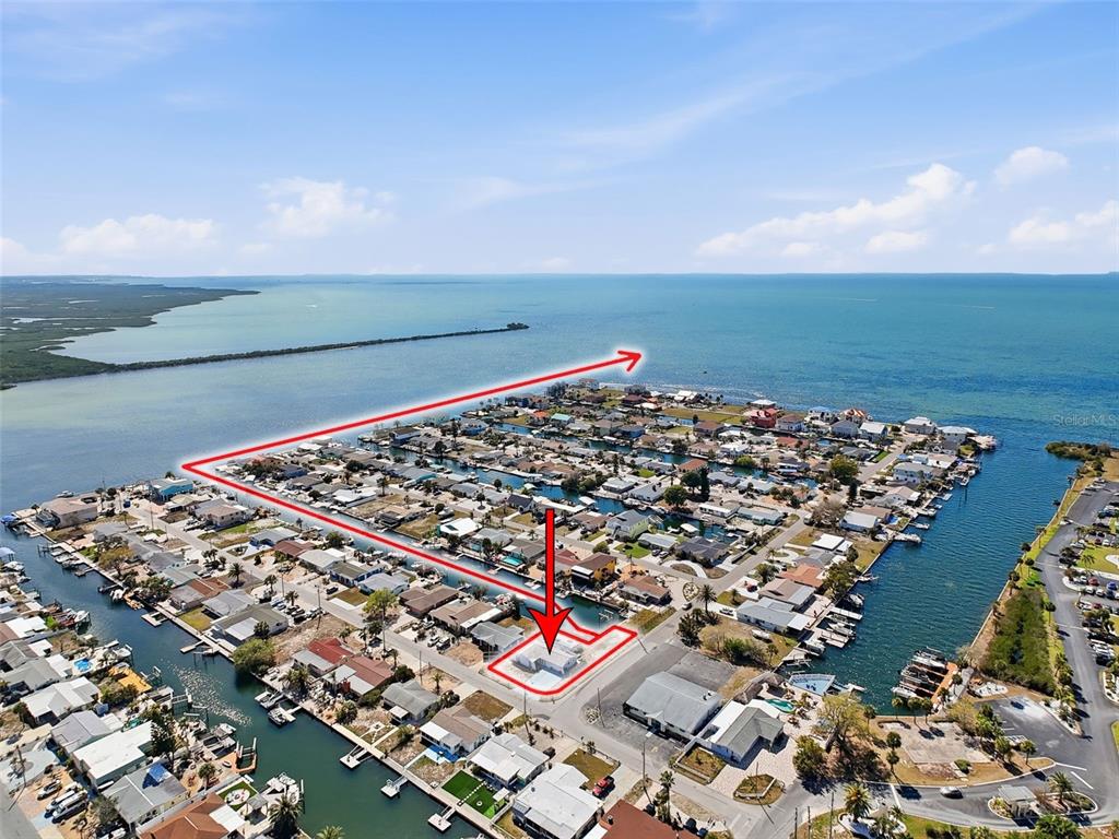 An aerial view shows a coastal neighborhood with a red outline highlighting a specific property — 13701 VERONICA DRIVE, HUDSON, FL
