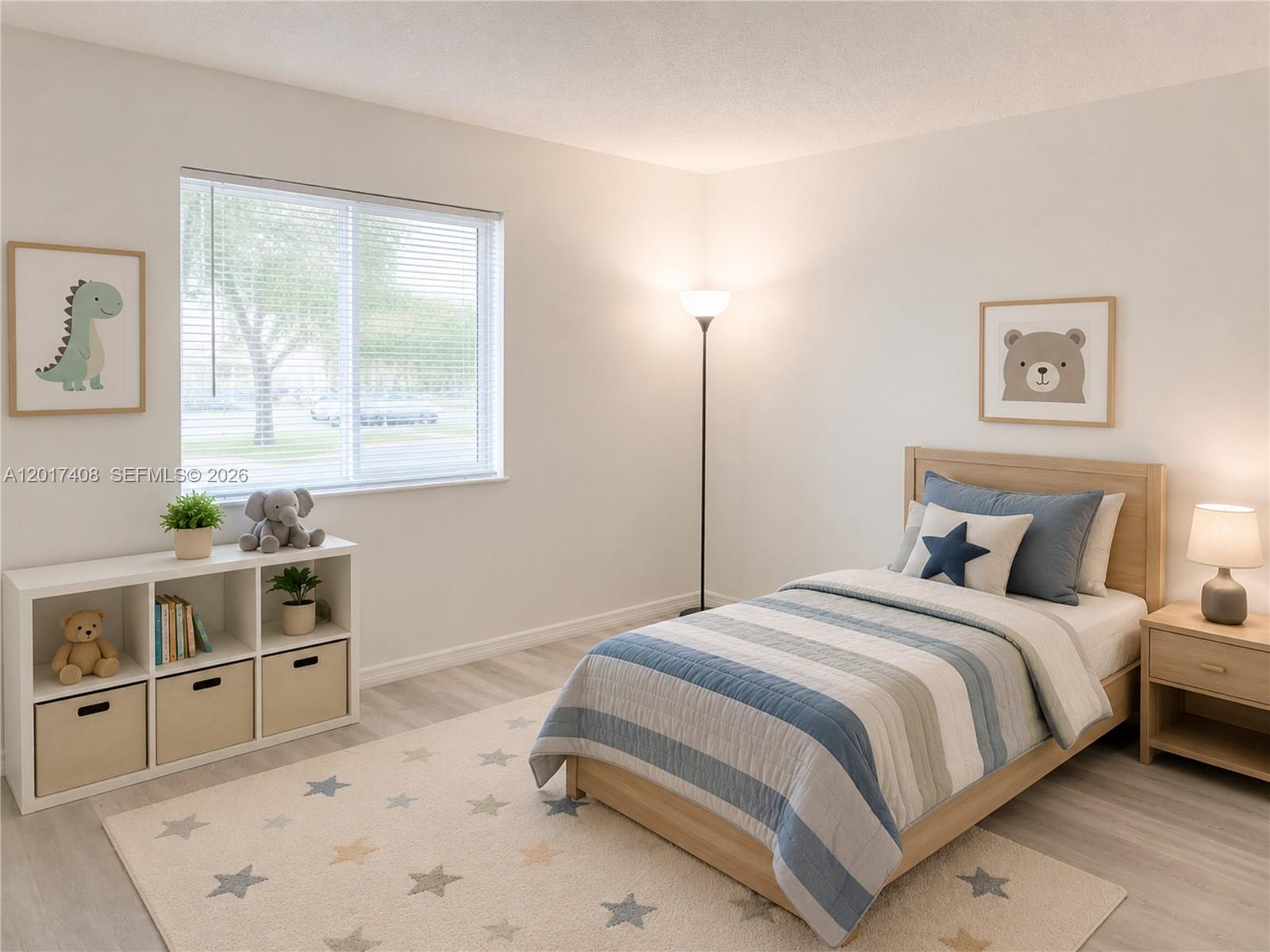 A child's bedroom features a twin bed, a storage unit, and star-patterned area rug — 14830 Naranja Lakes Blvd, Miami FL 33032, MIAMI, FL