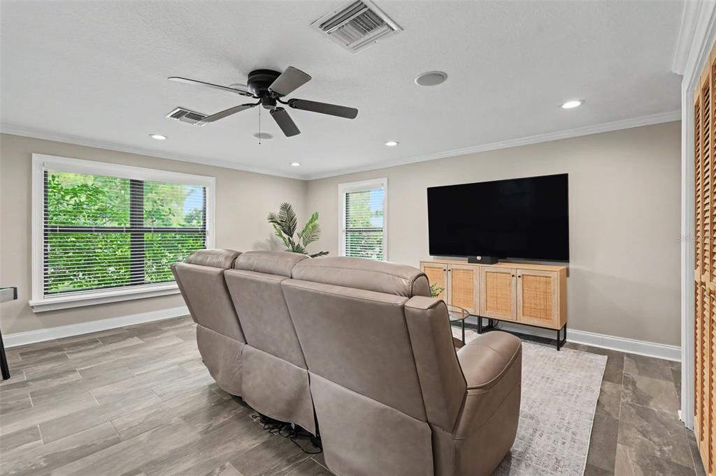 An entryway features a white double door, light tile flooring, and a potted plant — 475 HOLLY HILL ROAD, OLDSMAR, FL