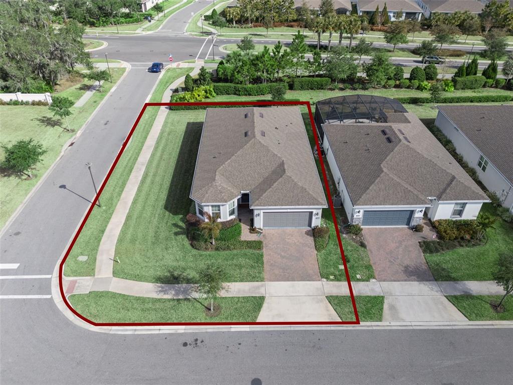 An aerial view shows a single-family home with a large side yard and driveway — 6237 CITRUS GROVE COURT, ST CLOUD, FL