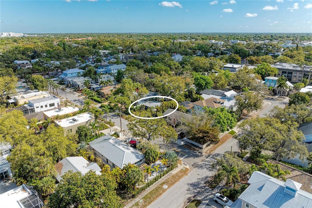 An aerial view shows a residential neighborhood with a house circled in white — 3625 JACINTO COURT, SARASOTA, FL