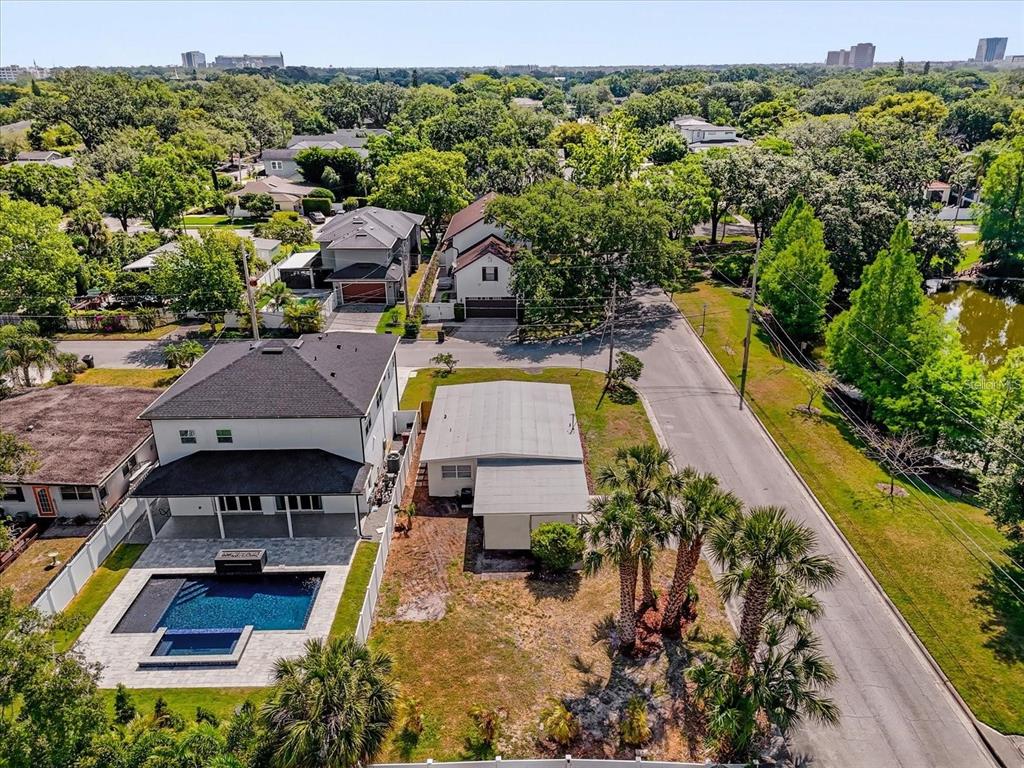 An aerial view shows a two-story house with a pool next to a smaller structure — 1600 HART LANE, ORLANDO, FL