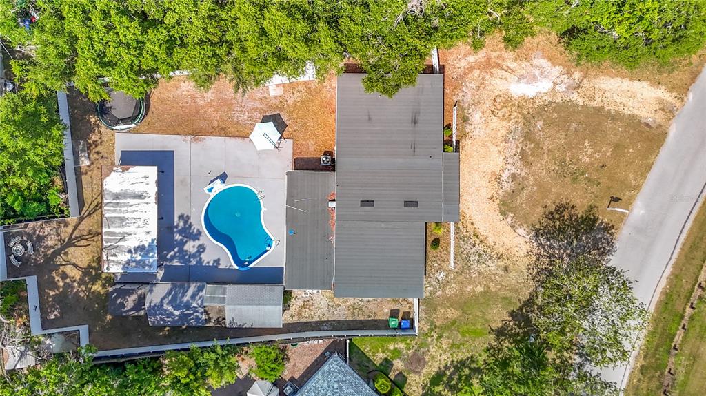 A single-story house with a flat roof, white exterior, and a white picket fence — 1506 S OREGON CIRCLE, TAMPA, FL