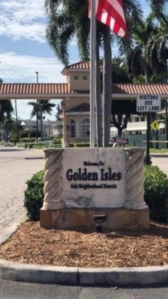 A stone monument sign welcomes visitors to the Golden Isles Safe Neighborhood District — 500 Layne Blvd # 14, Hallandale Beach FL 33009, HALLANDALE BEACH, FL