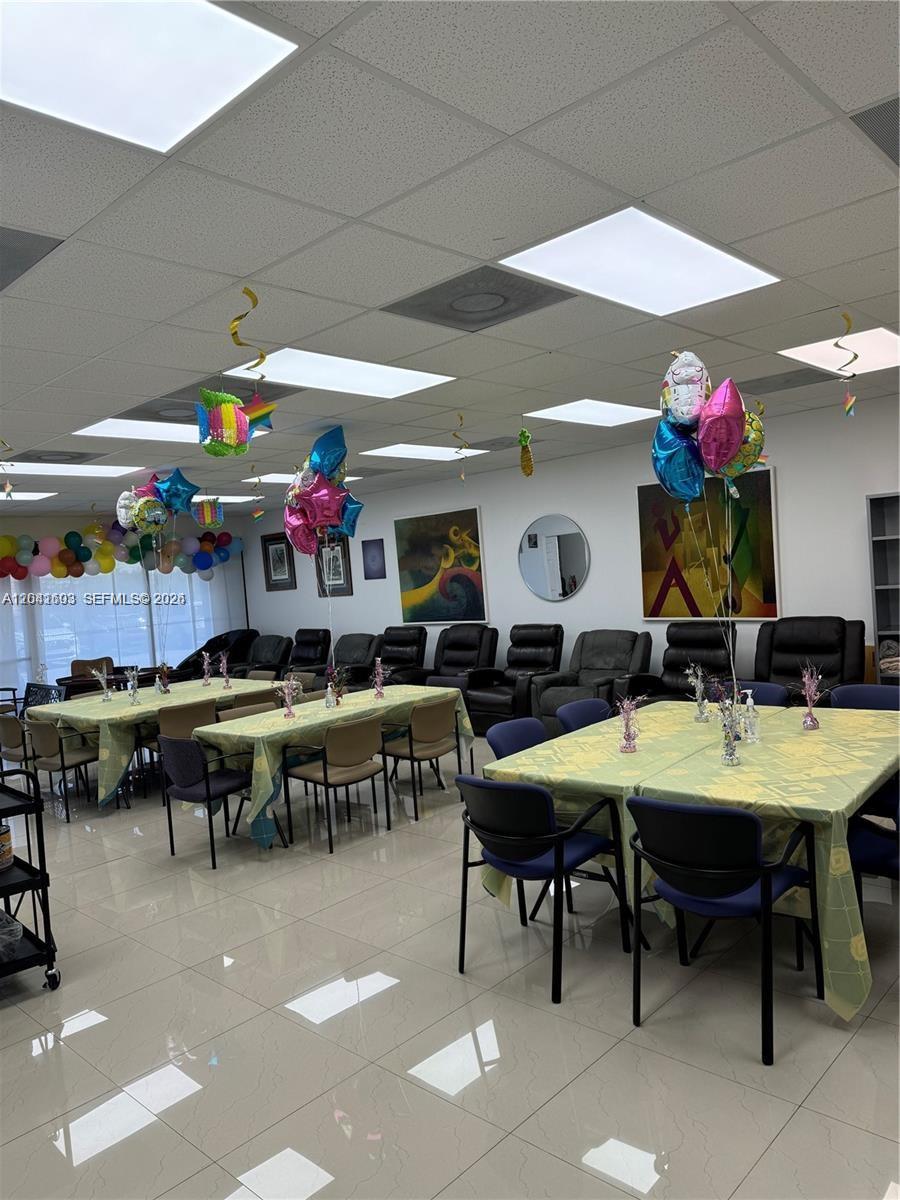 A room with tables, chairs, and balloons features a tiled floor and drop ceiling — 0000 W 20th Ln, Hialeah FL 33016, HIALEAH, FL