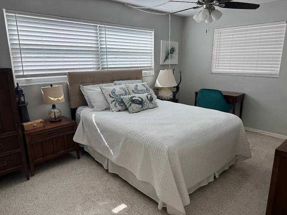 A bedroom features a queen bed, two nightstands, a desk, and white window blinds — 1511 Seabrook Road, Jupiter FL 33469, JUPITER, FL