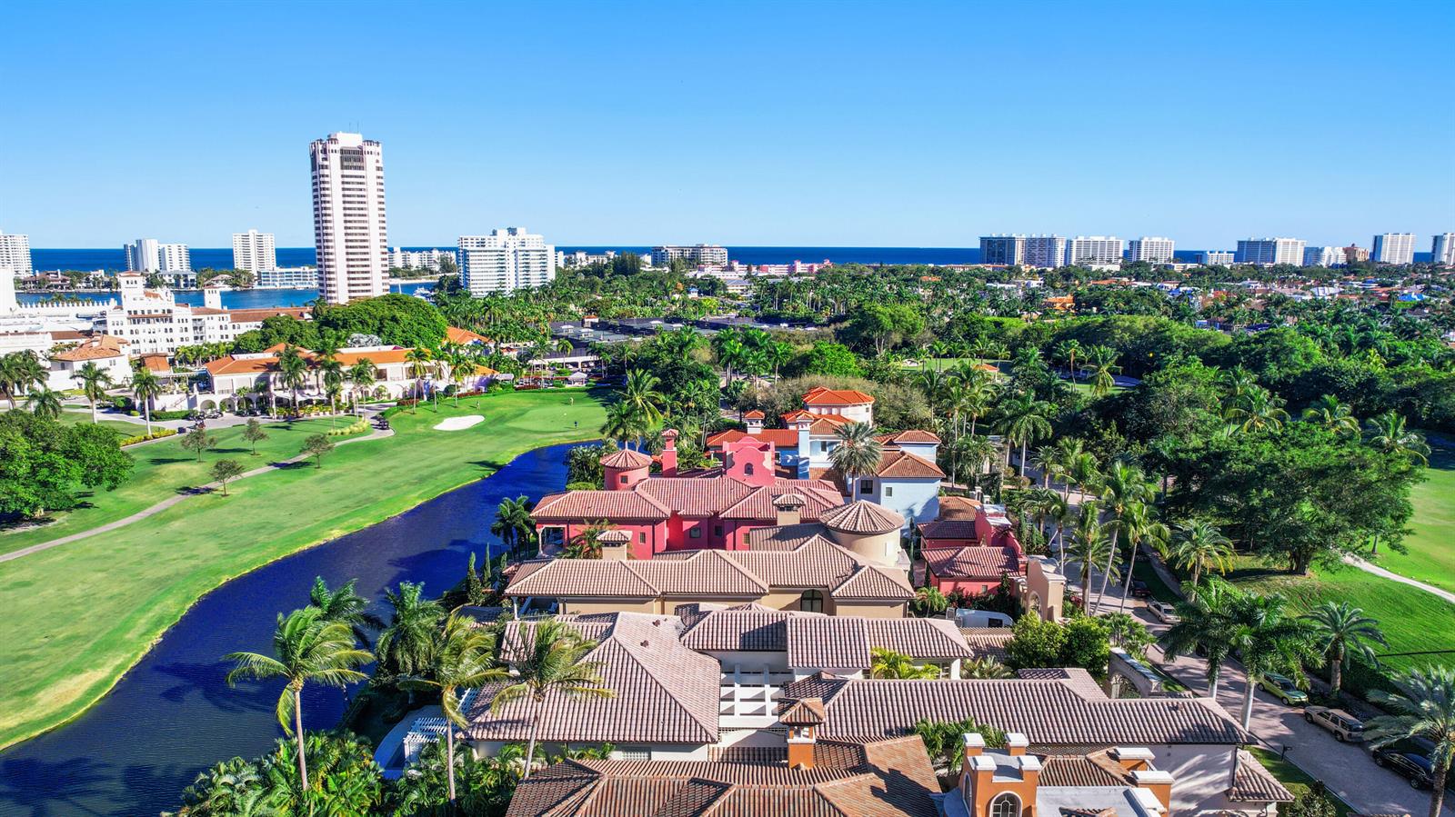 An aerial view of a large Mediterranean-style house situated on a golf course near water — 361 Mizner Lake Estates Drive, Boca Raton FL 33432, BOCA RATON, FL