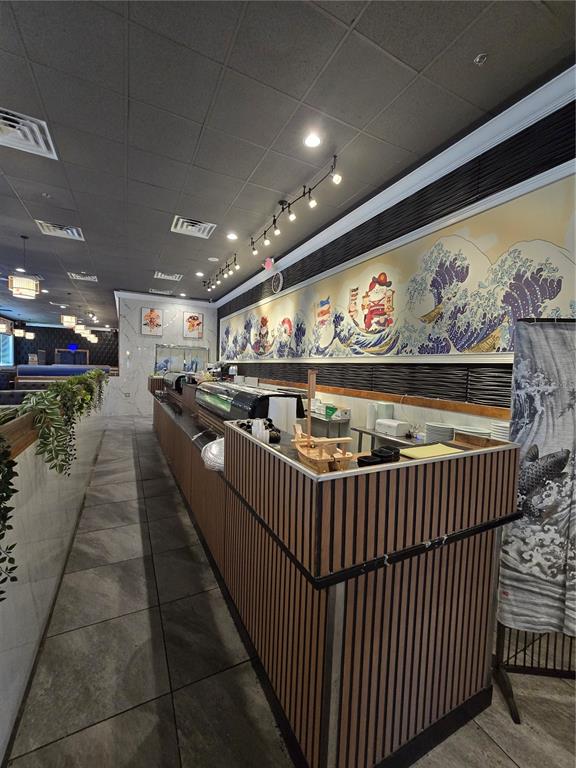 A sushi restaurant interior features a long wooden service counter and a Japanese-themed wall mural — 13605 SR 535 UNIT 102, ORLANDO, FL