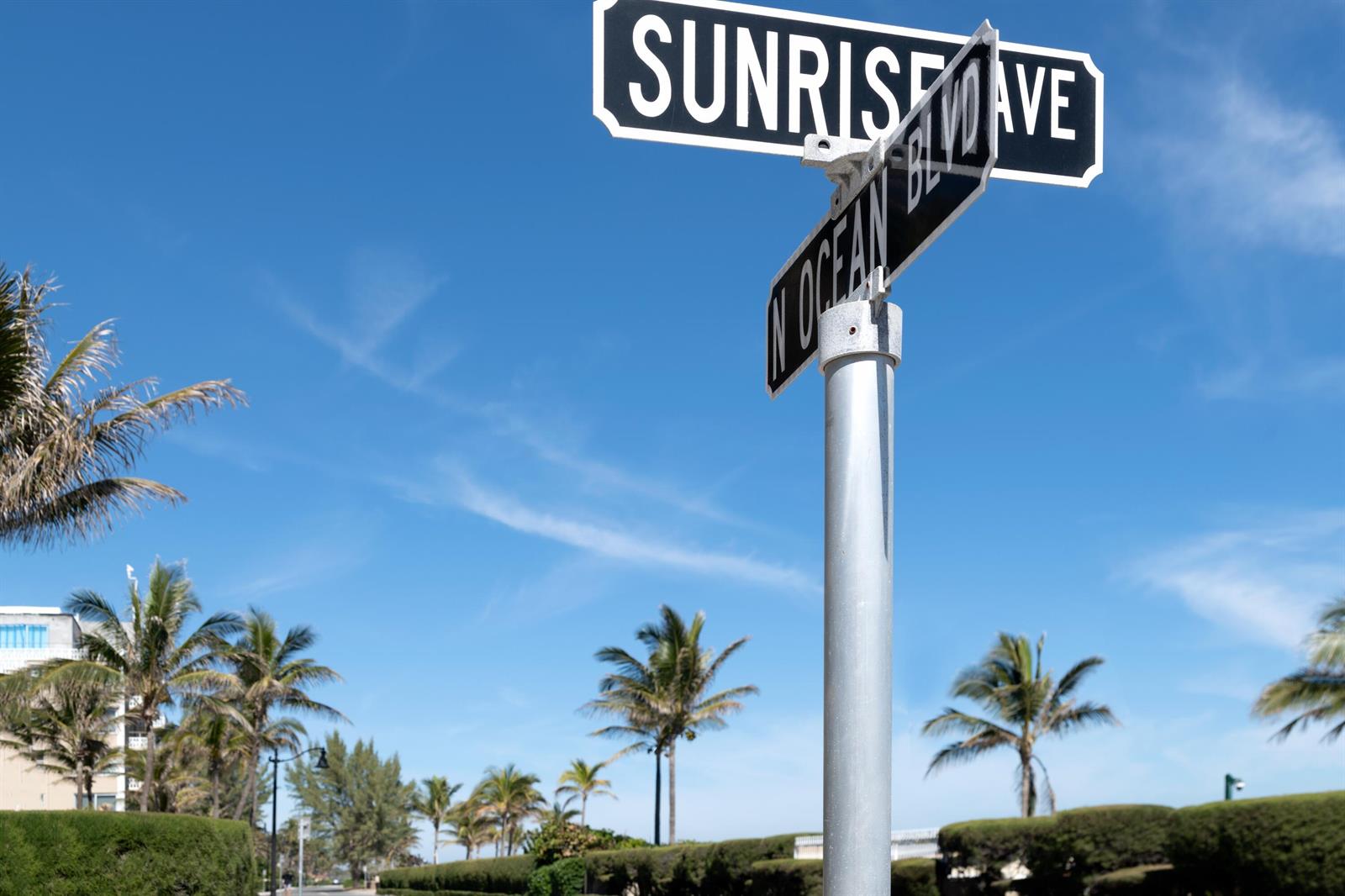 A street sign showing the intersection of Sunrise Ave and N Ocean Blvd under blue skies — 170 N Ocean Boulevard # 303, Palm Beach FL 33480, PALM BEACH, FL