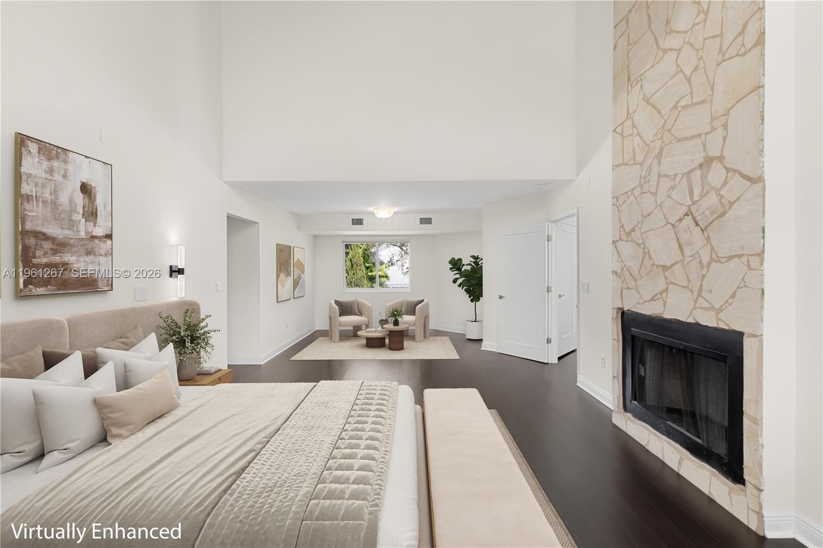 A bright entryway leads into a living area with light wood floors and white walls — 20205 W Oak Haven Cir, Miami FL 33179, MIAMI, FL