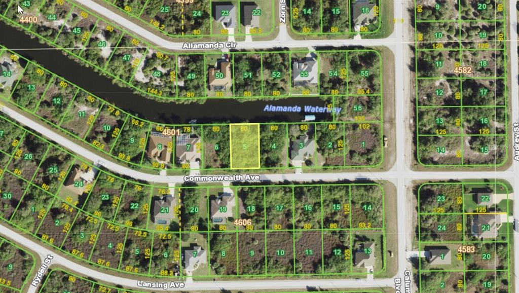 This is a satellite map showing residential lots and a waterway in a suburban neighborhood — 13484 COMMONWEALTH AVENUE, PORT CHARLOTTE, FL