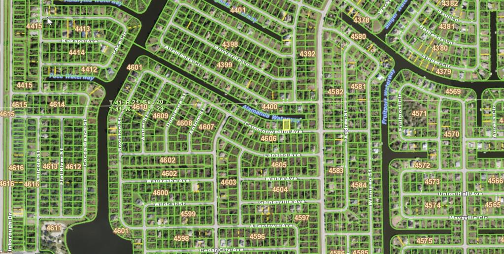 This is a map showing residential property lots and waterways in a suburban neighborhood — 13484 COMMONWEALTH AVENUE, PORT CHARLOTTE, FL