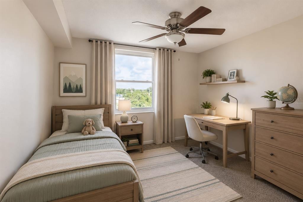 A bedroom features a twin bed, a wooden desk with a chair, and a dresser — 701 S MADISON AVENUE UNIT 502, CLEARWATER, FL