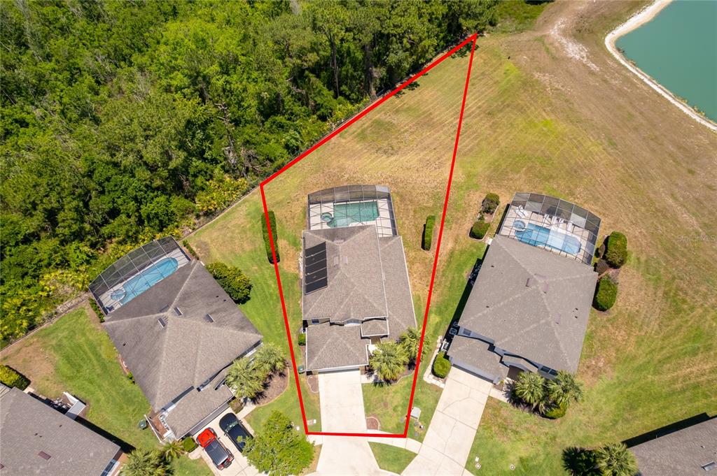 An aerial view shows a house with a pool and a large, irregularly shaped lot — 2808 LIDO KEY COURT, KISSIMMEE, FL
