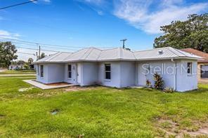 A light gray, single-story house with a white roof and a concrete driveway — 3100 W REYNOLDS STREET, PLANT CITY, FL