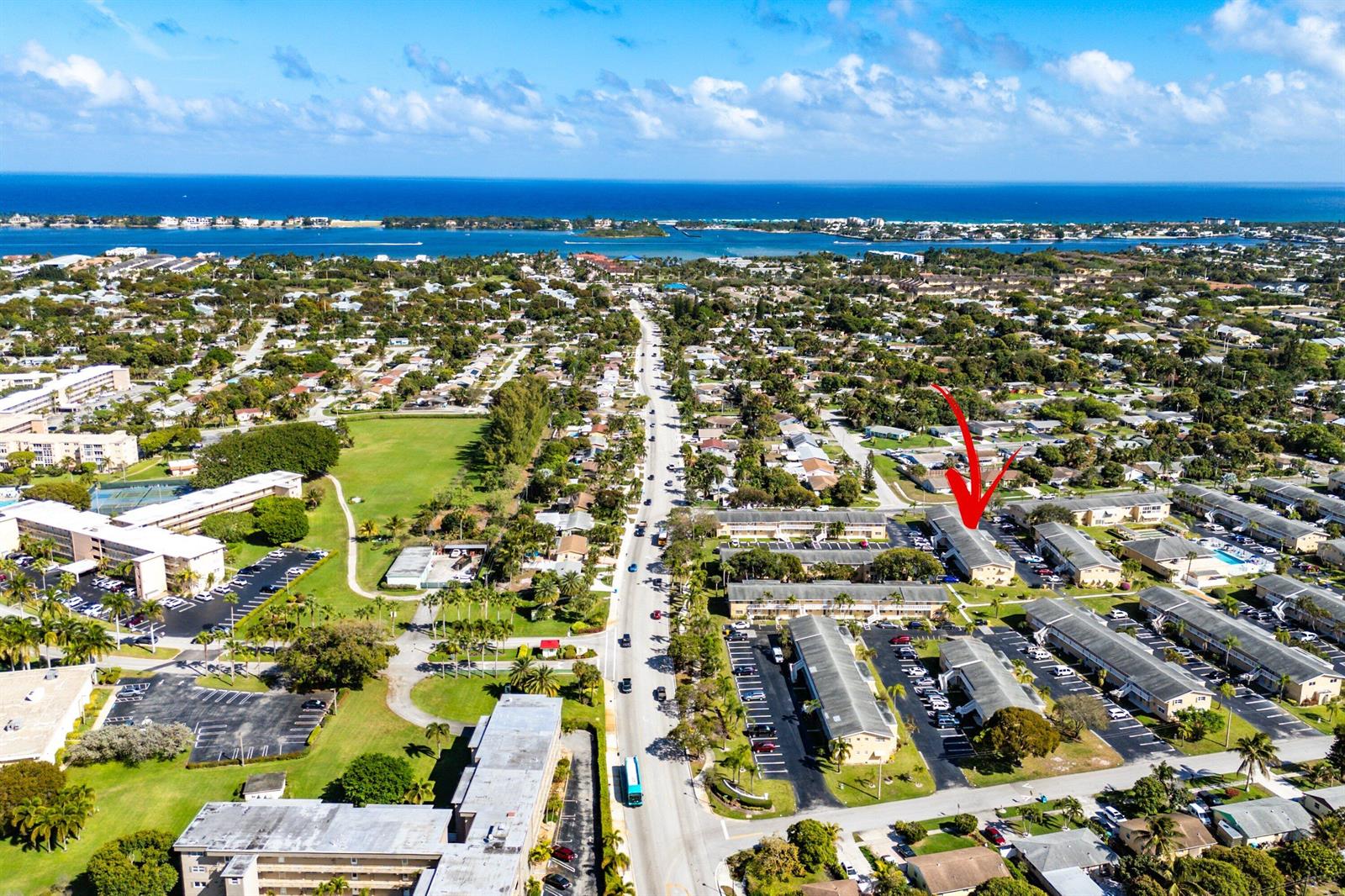 An aerial view shows a residential apartment complex with a red arrow pointing to a building — 2191 NE 1st Court # 202, Boynton Beach FL 33435, BOYNTON BEACH, FL