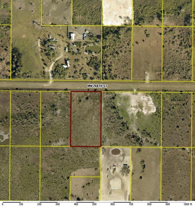 An aerial map view shows a rectangular plot of land outlined in red along a road — 18826 NW 260th Street, Okeechobee FL 34972, OKEECHOBEE, FL