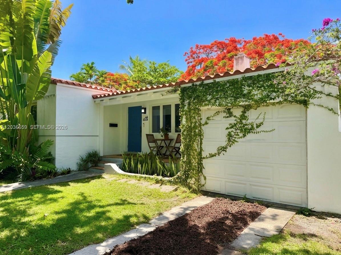 A white house with a red tile roof, a blue door, and a garage — 454 NE 76th St, Miami FL 33138, MIAMI, FL