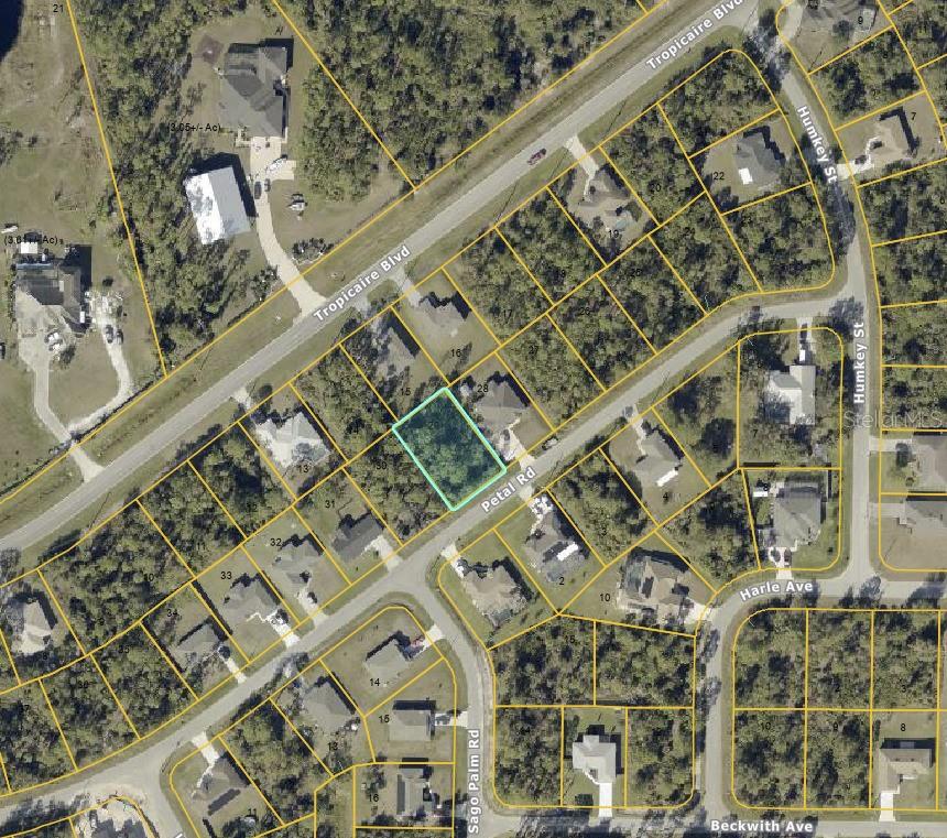 An aerial map view shows a vacant, rectangular residential lot highlighted in blue on Petal Road — PETAL ROAD, NORTH PORT, FL